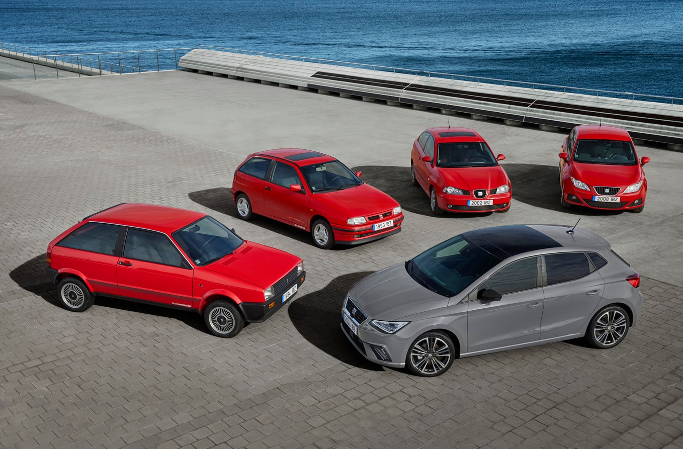 woman leaning on seat ibiza desire red colour watching her friends