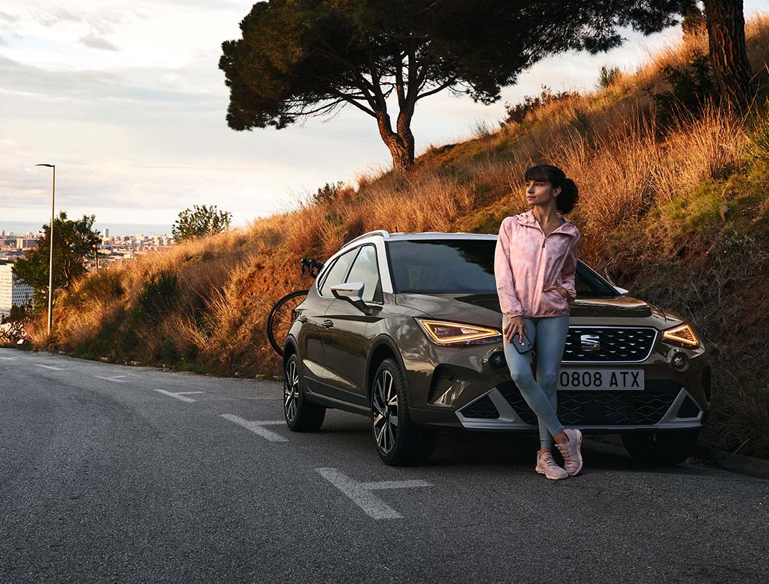 woman leaning against seat arona